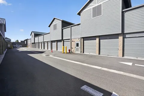 Exterior of gray-sided building featuring climate-controlled storage in Park City, UT, including ground-level drive-up storage units