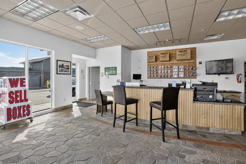 Interior of the office at Storage Star Self-Storage in Park City, UT, showcasing a long counter, packing supplies, and moving boxes