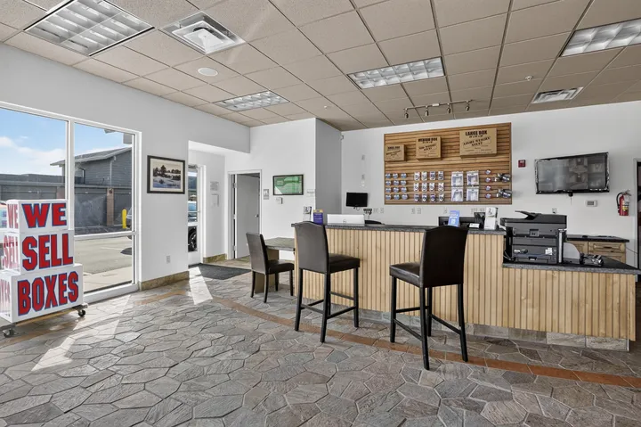 Interior of the office at Storage Star Self-Storage in Park City, UT, showcasing a long counter, packing supplies, and moving boxes