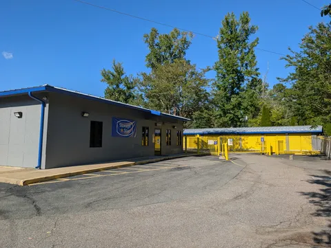 Rental office at Storage Star self-storage in Glen Allen, VA, with a security gate in front of a paved driveway
