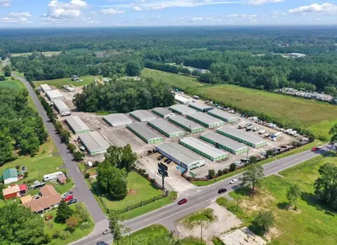 Aerial view of Storage Star Self-Storage in Longs, SC, on Highway 90, featuring outdoor vehicle storage, drive-up storage, and a rental office with indoor storage units