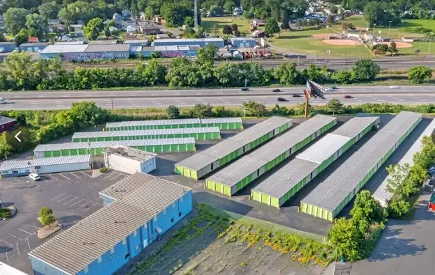 Aerial view of Storage Star Self-Storage in Albany at 1025 Central Ave, with green drive-up units located next to a major highway