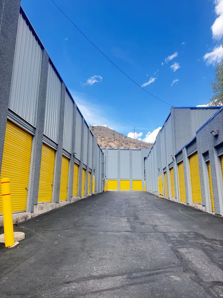 Outdoor drive-up storage units in Avon at 850 Nottingham Rd, with yellow roll-up doors and wide paved driveways