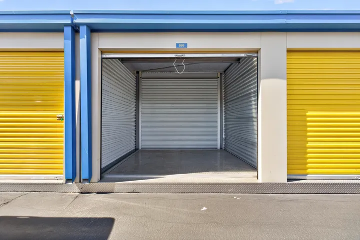 An open, clean drive-up storage unit in Fairfield on Lopes Rd with corrugated metal walls and a metal floor plate