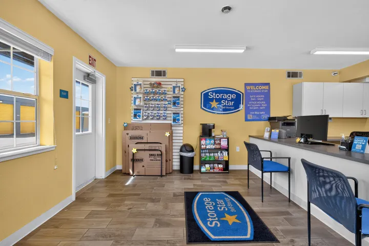 Interior office at Storage Star Self-Storage in Fairfield on Lopes Rd, featuring moving supplies for sale, Storage Star signage, and a customer service desk