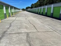 Wide driveway with both sides featuring drive-up storage units in Rockledge, FL