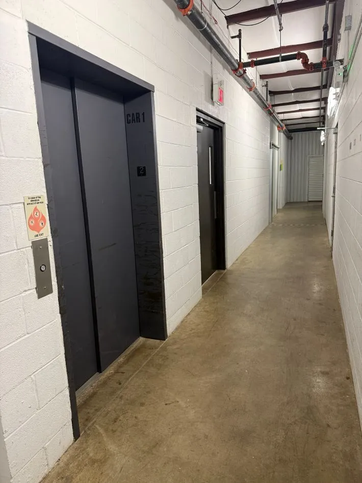 Indoor storage facility hallway featuring elevator access