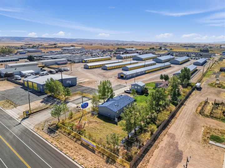 High-angle aerial view of Storage Star Self-Storage in Laramie on Skyline Rd, with multiple rows of drive-up storage buildings