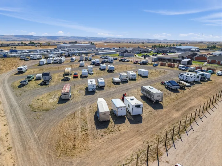 Aerial view of Storage Star Self-Storage in Laramie on Skyline Rd, featuring rows of drive-up storage units and outdoor vehicle parking areas