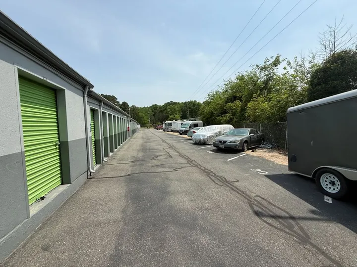 Outdoor vehicle parking in Williamsburg, VA, featuring trailer, car, and RV storage