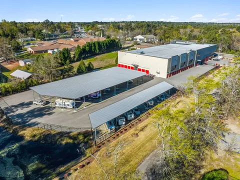 Aerial view of a multi-story storage building with covered RV and boat parking in Aiken on Hamilton Drive