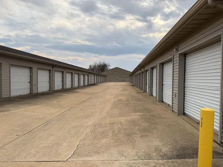 Wide drive aisle with drive-up storage units in Champaign at 606 S Staley Rd