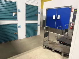 Moving carts and dollies next to storage lockers