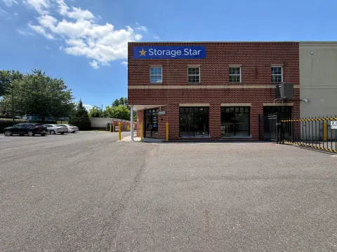 Exterior view of Storage Star Bordentown with paved parking and a gated entrance