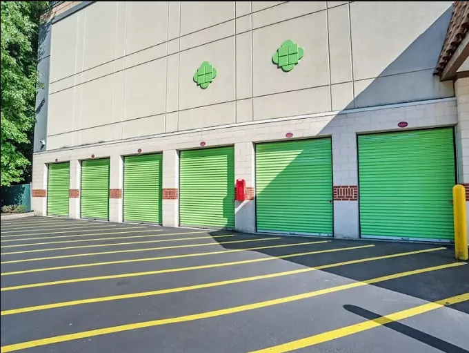A row of green drive-up self-storage unit doors at Storage Star in Edison