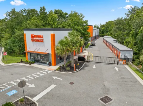 Exterior of a Mini Mall Storage facility with a gated entrance, rental office, and drive-up units