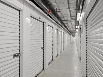 Long interior hallway of climate-controlled storage units.