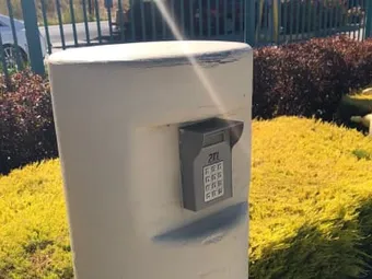 Keypad entry for security gate access.