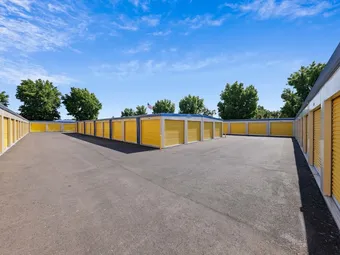 Rows of yellow storage unit doors visible from above.