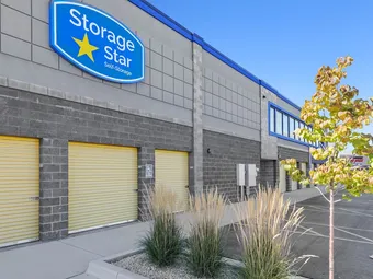 Exterior of building with Storage Star logo and yellow unit doors.