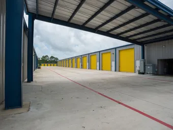Row of yellow drive-up storage unit doors