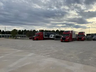 Outdoor vehicle storage in Champaign, IL on Lager Drm featuring trailers, cars, and large commercial vehicles