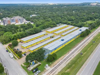 Aerial view of self-storage facility with multiple buildings and roads.