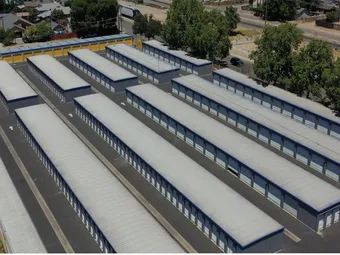Aerial view of self-storage facility with multiple rows of outdoor units.