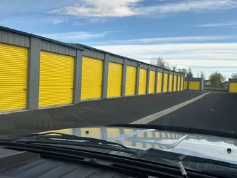 View of drive-up storage units from a car.