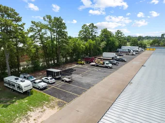 Aerial view of outdoor parking lot with various vehicles