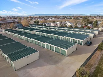 Aerial view of many rows of outdoor drive-up storage units.