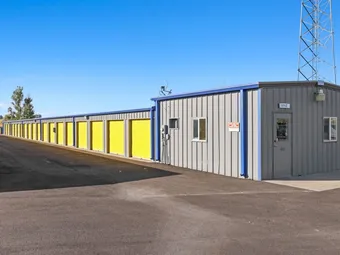 Exterior view of the office building next to storage units.