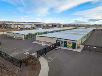 Office building with storage units and neighborhood in background