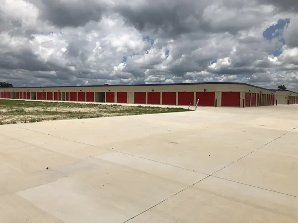 Wide driveway facing rows of storage units