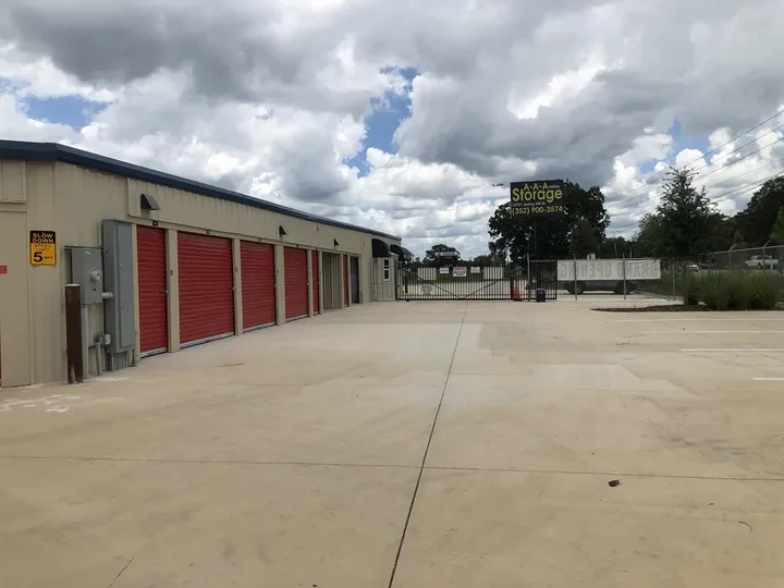 Drive-up storage building alongside parking area