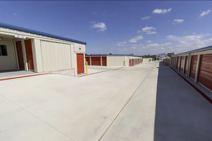 Outdoor drive-up storage buildings and drive aisles