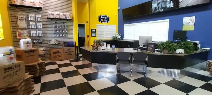Customer service office and retail area with moving supplies.