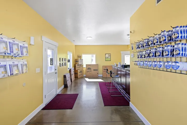 Rental office interior with packing supplies and counter.