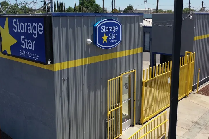 Storage Star facility exterior with office entrance and security gate.