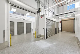Multi-level loading area with various storage unit doors.