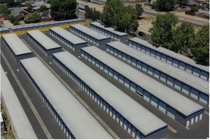 Aerial view of self-storage facility with multiple rows of outdoor units.