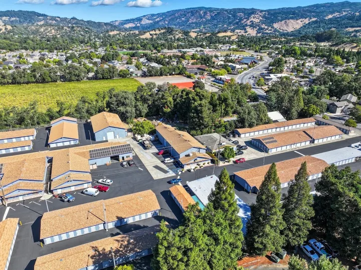 Aerial view of storage facility and surrounding area with hills