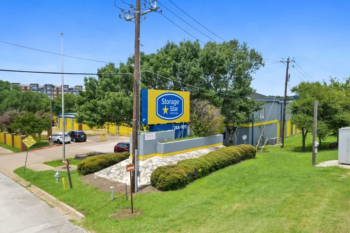 Exterior view of facility with large blue and yellow monument sign.