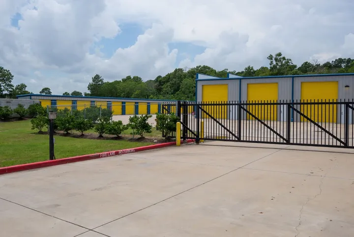 Exterior view of secure storage facility gate and buildings