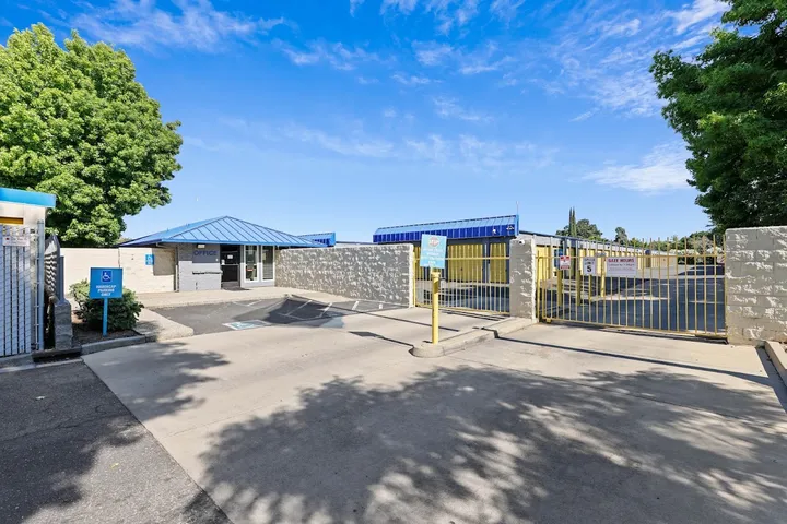 Entrance to the storage facility with office and security gate.