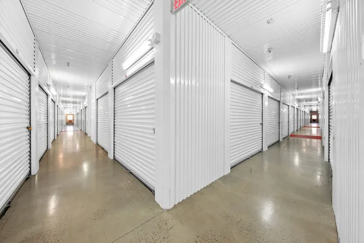 Indoor climate-controlled storage unit hallway.