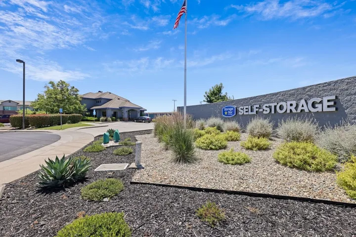Building exterior and monument signage at facility entrance.