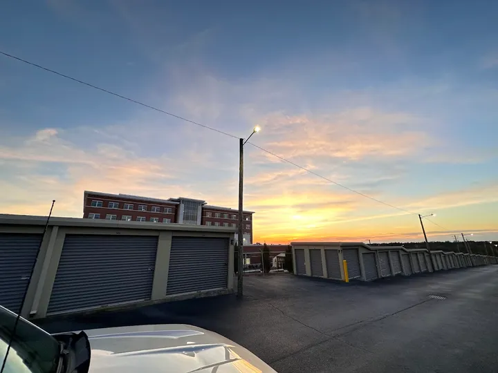 Outdoor drive-up storage units at sunset
