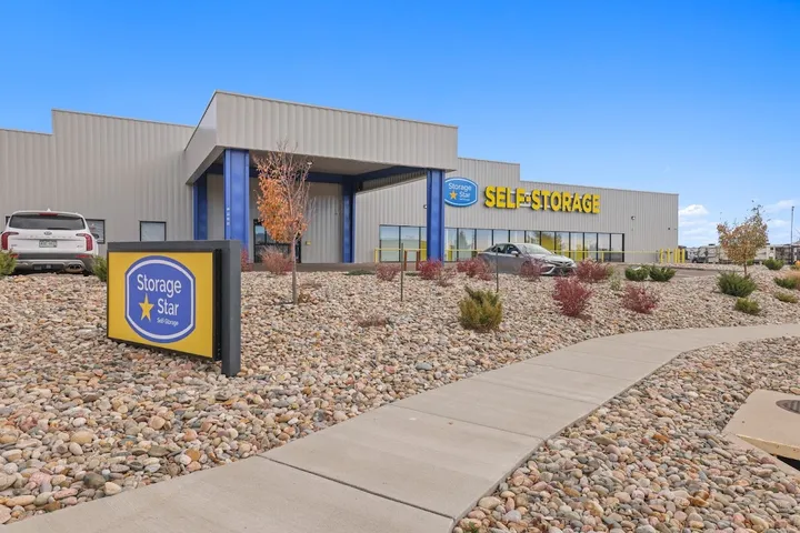 Storage facility exterior with building and monument sign.