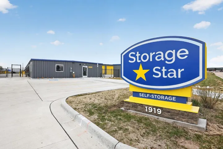 Storage facility sign next to the office building.